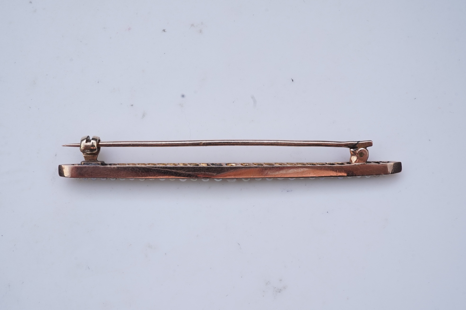 An Edwardian seed pearl brooch and a pearl and diamond ring
